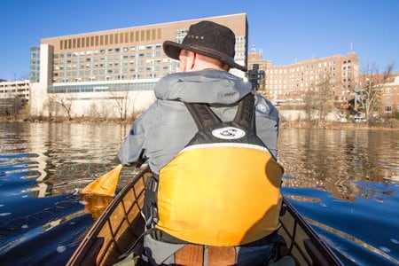 Alexander J. Schad, MD, and St. Cloud Hospital. Dr. Schad often paddles his canoe from his home 10 to 20 minutes upstream on the Mississippi River.