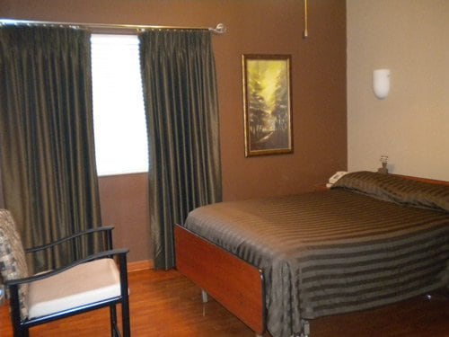 Sleep Room - Each room is private and equipped with amenities that rival a nice hotel, including a comfortable queen size Sleep Number bed, phone, chair, flat screen television, ceiling fan and private bathroom with shower (below) sure to make you feel right at home.