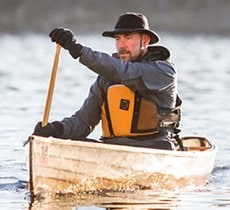 Dr. Schad paddling to work on the Mississippi River