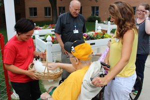 Furry friends, face-painting and families fill Lillian's garden on a picture perfect summer afternoon for the annual petting zoo.