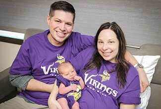 Vikings fan baby girl Vaeda Rose Sarder with parents Jeremy and Amber Sarder, born on Oct. 9. To help celebrate special occasions or holidays, the Family Birthing Center team also likes to provide babies born during these times with a small gift to mark the occasion.