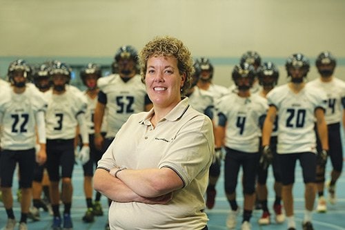 Dr. Becky Mueller supports the Becker High School football team with sideline medical care.