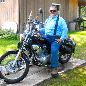 Alec rewarded himself with a new motorcycle once he hit the 50-pound weight loss mark in Summer 2018.